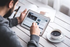 Man Reading Touchscreen