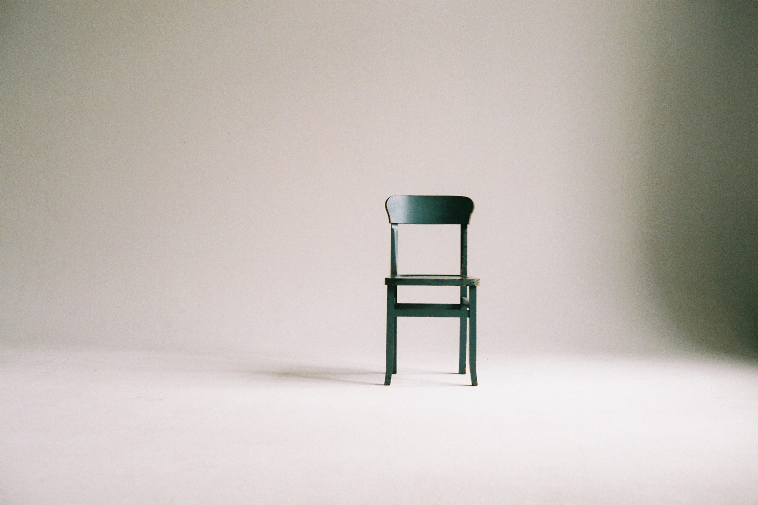 Image of a black chair in an empty room