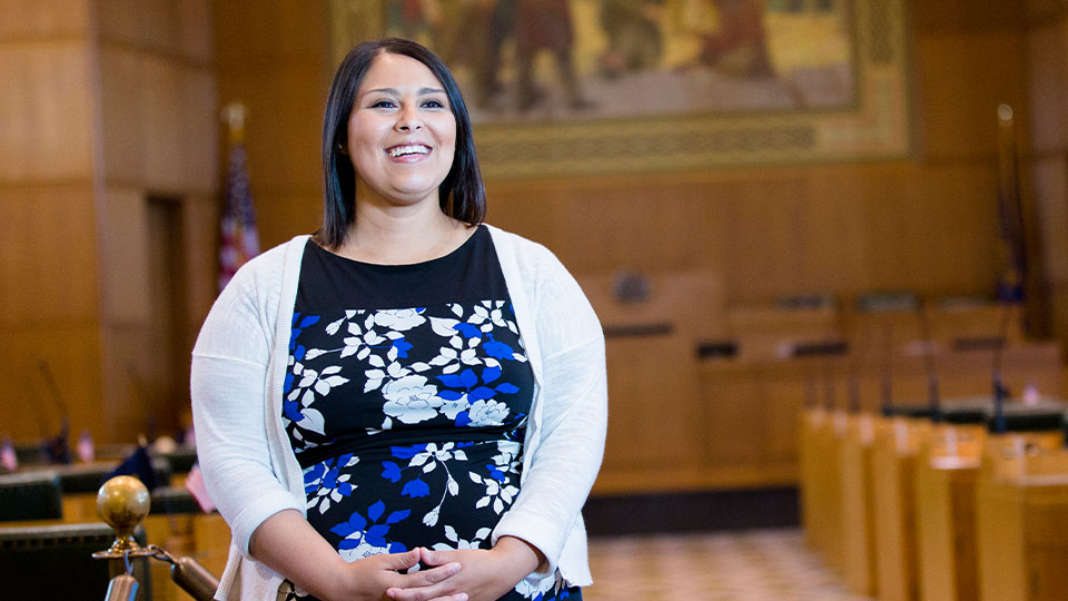 OSU Public Policy graduate, Jessica Nguyen, smiles in the Oregon state courthouse in Salem, Oregon