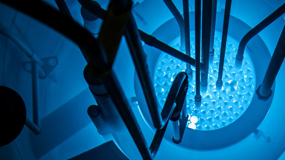 A TRIGA&reg; (Training, Research, Isotopes, General Atomics) research reactor gives off glowing blue light