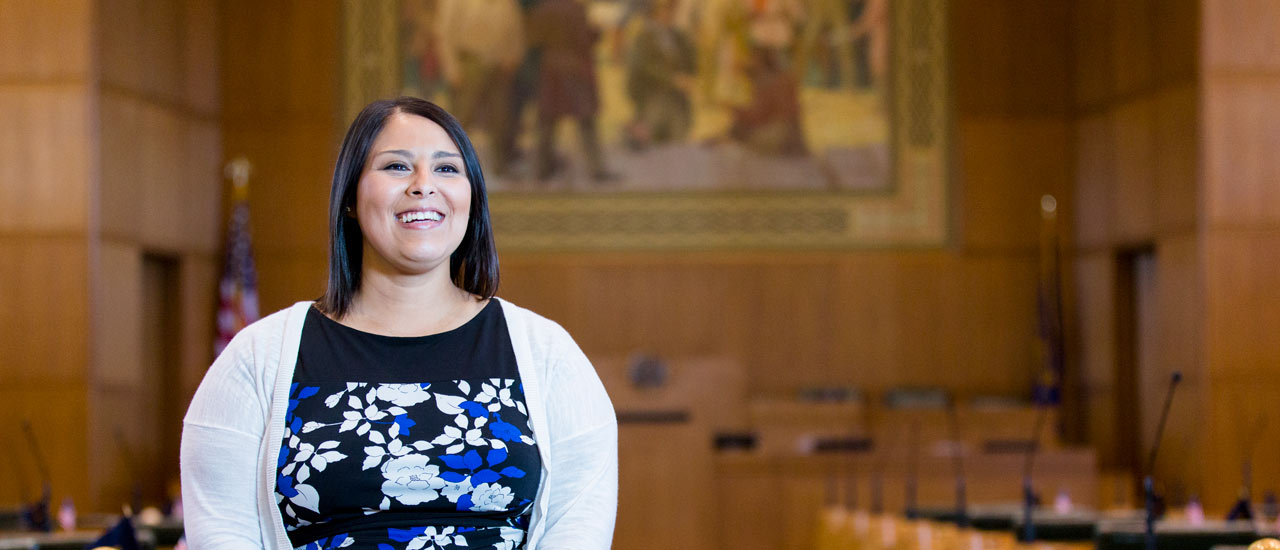 OSU Public Policy graduate, Jessica Nguyen, smiles in the Oregon state courthouse in Salem, Oregon