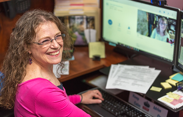 Dawn Marie Gaid, Oregon State Ecampus environmental sciences undergraduate advisor, video conferences with a student in her office.