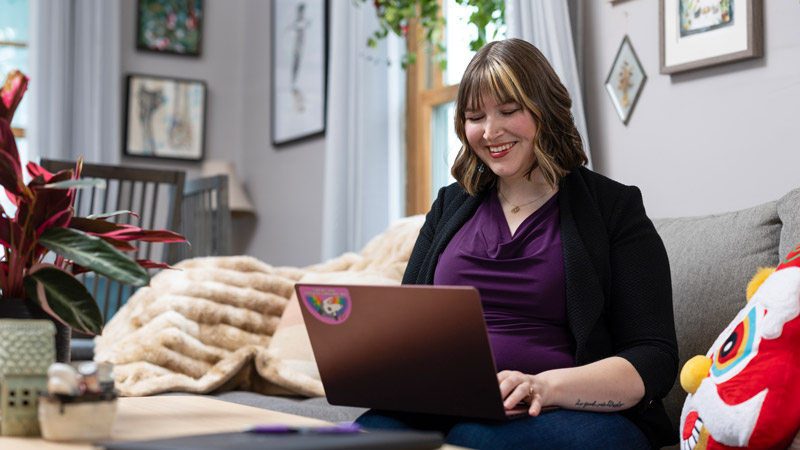Ecampus student Kaitlin Lee works on a computer in her home.