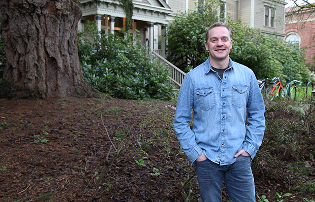 Scott Akins stands in front of Fairbanks Hall on the Oregon State University campus.