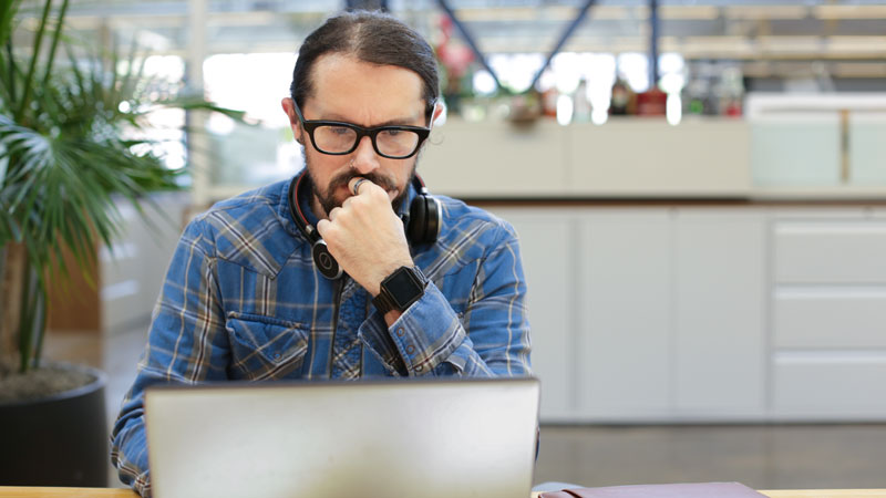 man looking at laptop