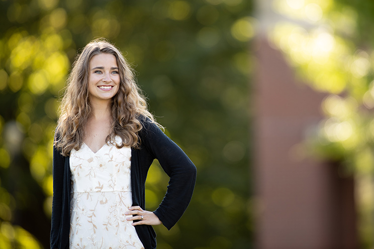 Andrea Fuchs, an Oregon State University Ecampus graduate in fisheries and wildlife sciences, stands on the OSU campus in Corvallis in June 2019.