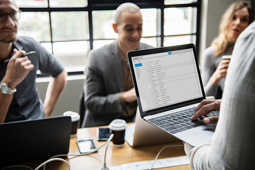 Business professionals in an office with computers