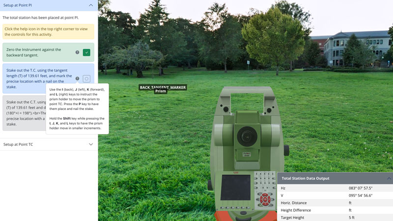 Screenshot of an online surveying simulation showing a total station aimed at a prism labeled 'Back Tangent Marker' in a grassy field with trees and buildings in the background.