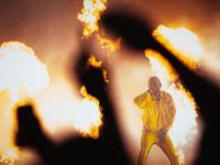 Performer Kendrick on stage with fire all around