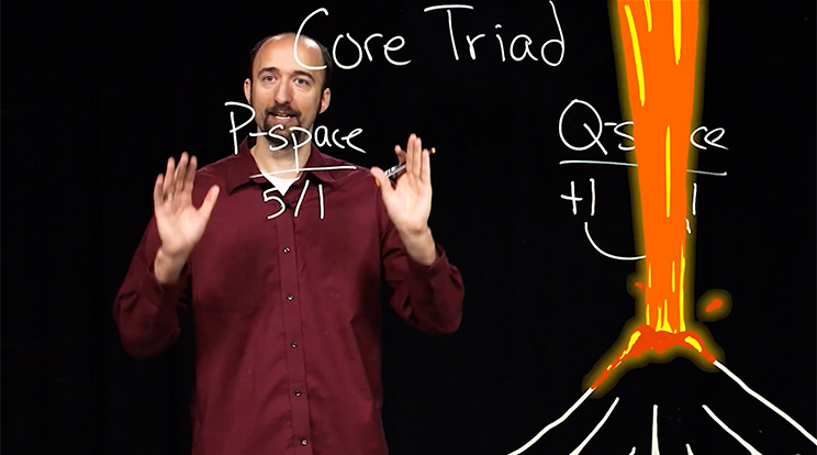 A professor stands behind a clear lightboard with writing on as an animated erupting volcano is to his left. Online courses at Oregon State